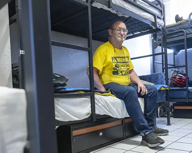 Guest at shelter on bunk